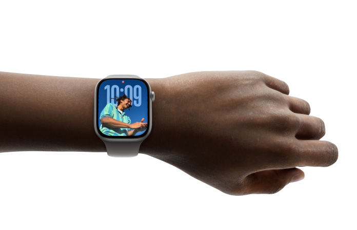 A person wears Apple Watch Series 11 with Photos watch face