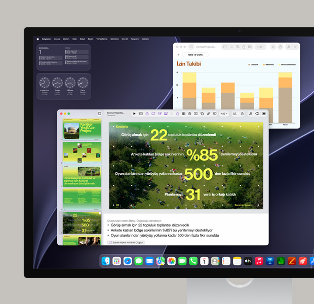Dock'ta bulunan çeşitli uygulamaları ve kullanımdaki Safari ve Adobe Acrobat’ı gösteren renkli ekran