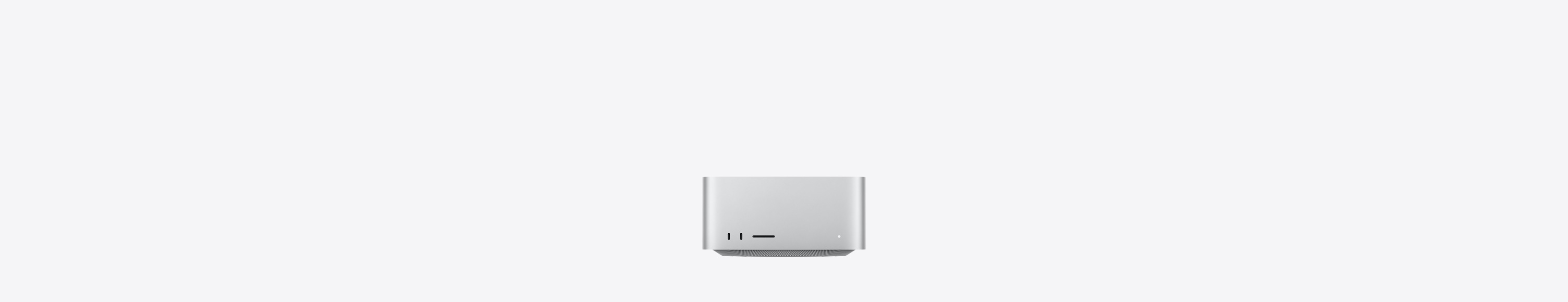 Mac Studio, front, two USB-C ports, SDXC card slot, status indicator light, tapered base at bottom, flat top, rounded sides, straight edges, silver color