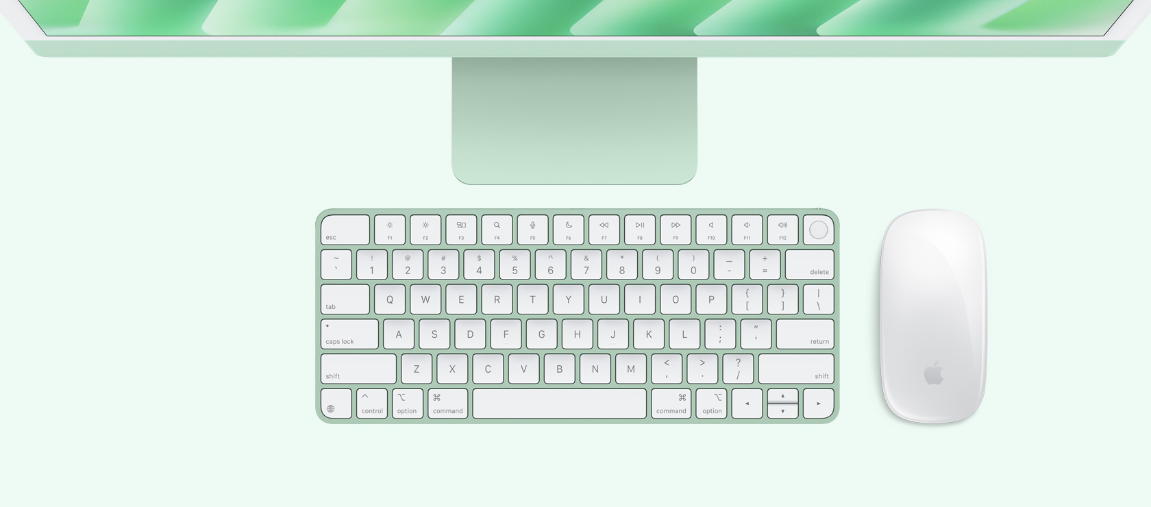 Imagem aérea de um iMac verde com mouse e keyboard na mesma cor