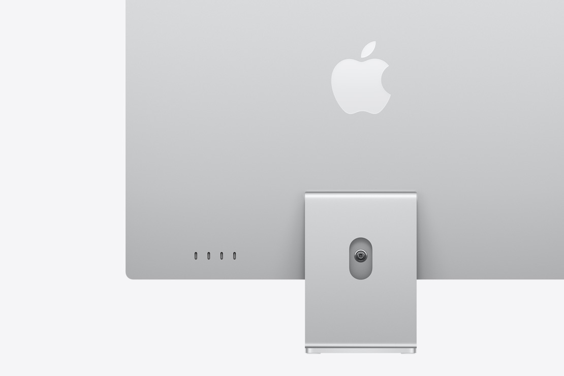 Imagem da parte de trás de um iMac prateado, com destaque para as quatro portas USB-C