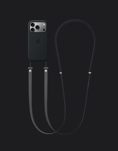 iPhone 17 Pro, taustapuoli, värinä hopea, sekä musta silikonikuori MagSafella, kiinnitettynä tummanharmaa olkahihna
